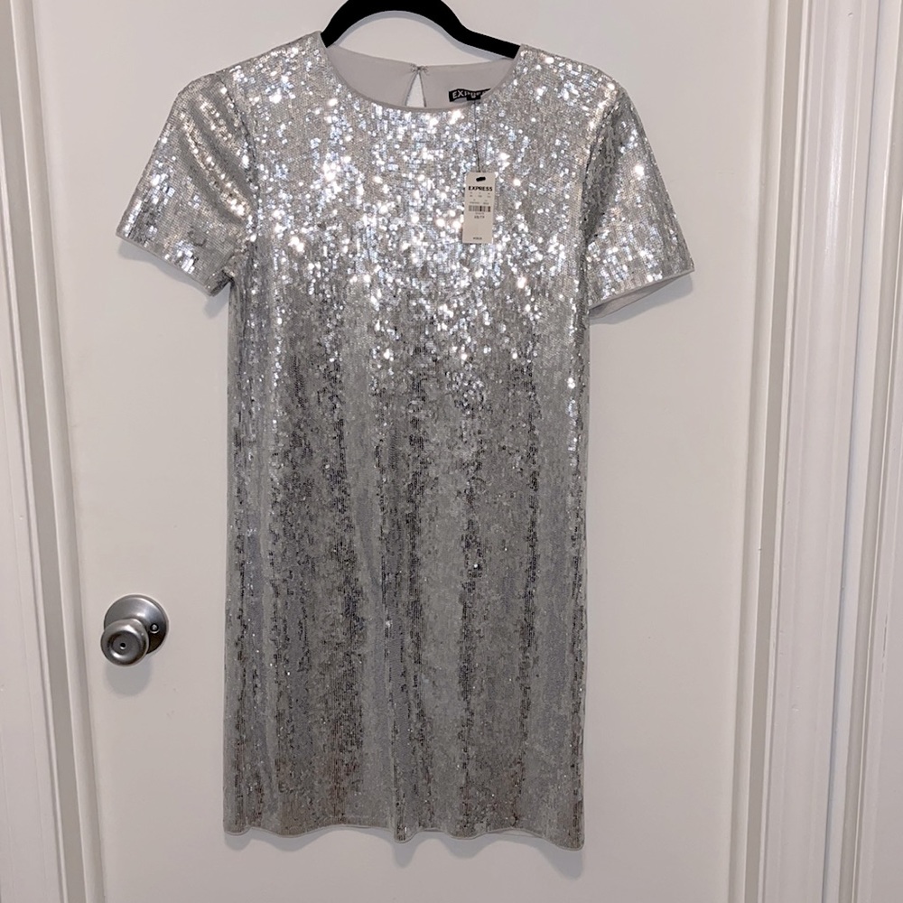 Silver sequins mini dress!! Can also be worn with jeans! Never worn!